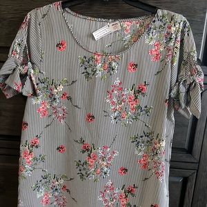 Boutique blouse size M. Black and white stripes with floral print.